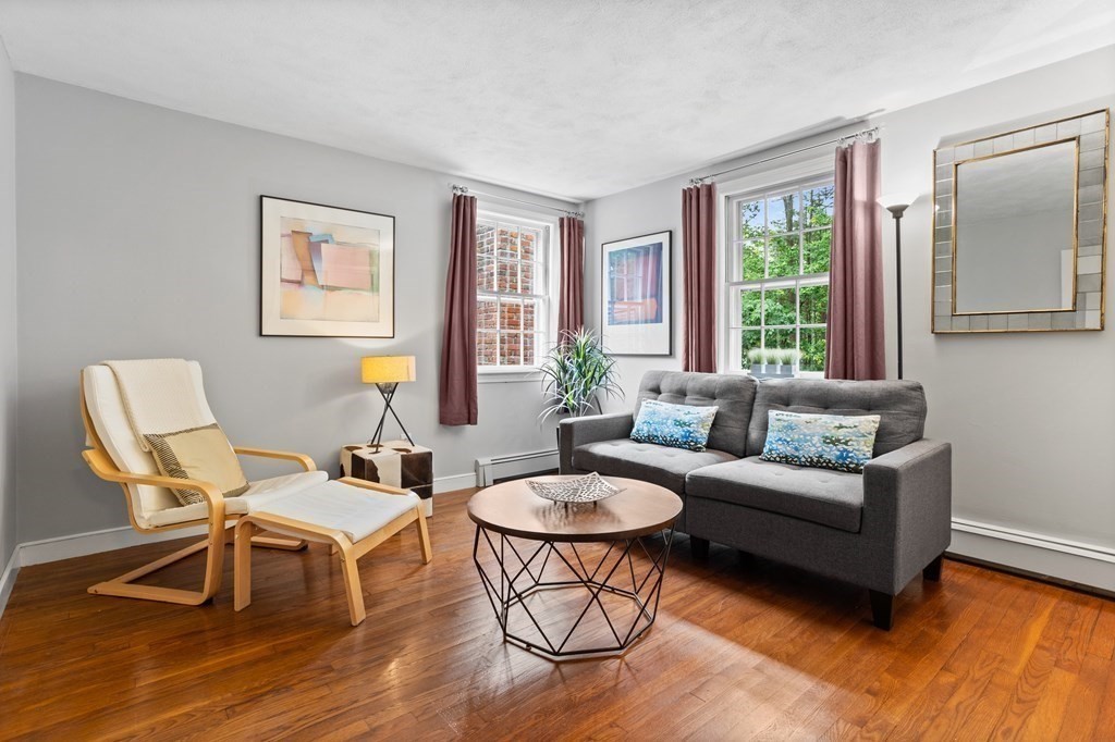86 Pine Hill Road Boxborough, MA 01719 - Photo 24 of 42 a living room with furniture and a wooden floor