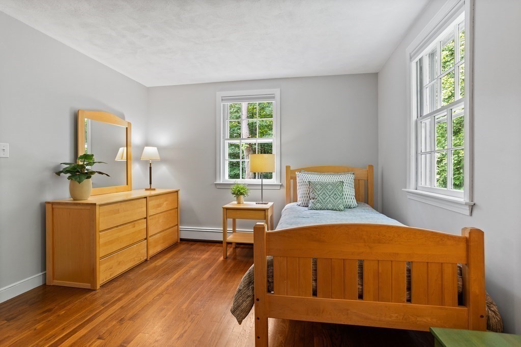 86 Pine Hill Road Boxborough, MA 01719 - Photo 26 of 42 a bedroom with a bed and a dresser