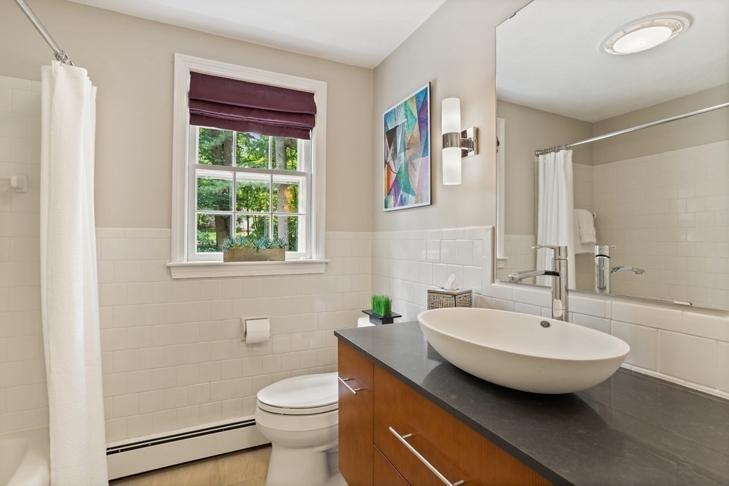 86 Pine Hill Road Boxborough, MA 01719 - Photo 27 of 42 a bathroom with a sink and a mirror