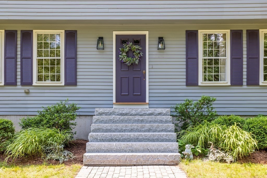86 Pine Hill Road Boxborough, MA 01719 - Photo 30 of 42 a view of a house with potted plants and a fountain