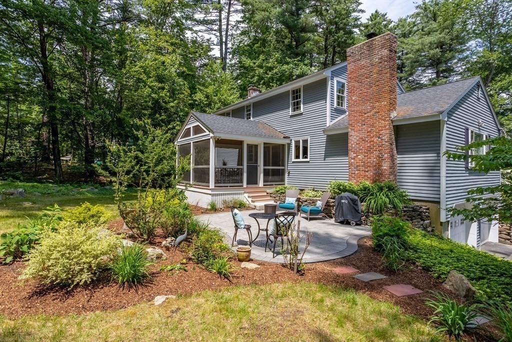 86 Pine Hill Road Boxborough, MA 01719 - Photo 34 of 42 a front view of house with a garden and patio
