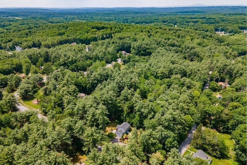 86 Pine Hill Road Boxborough, MA 01719 - Photo 39 of 42 an aerial view of a house with a yard