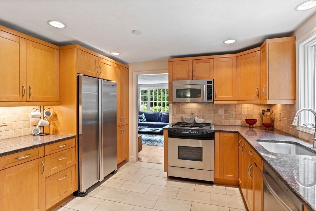 86 Pine Hill Road Boxborough, MA 01719 - Photo 4 of 42 a kitchen with stainless steel appliances granite countertop a stove sink and refrigerator