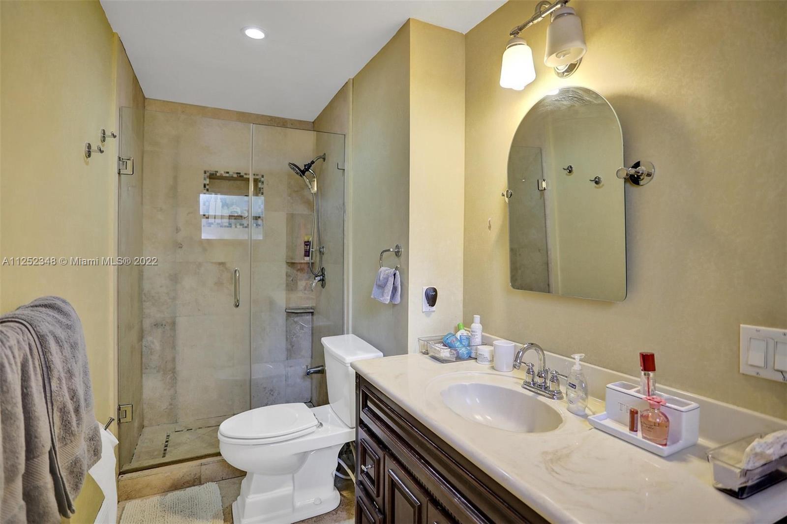 5930 Southwest 47th Street Miami, FL 33155 - Photo 17 of 43 a bathroom with a sink toilet and shower