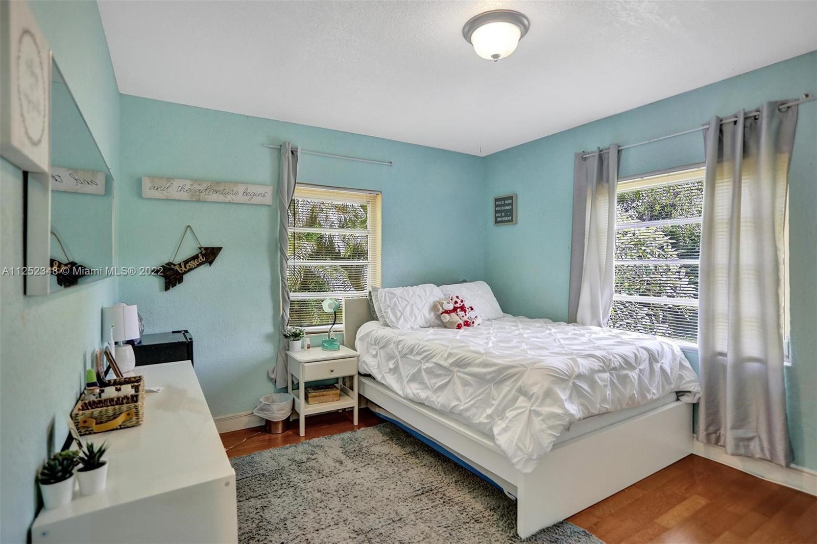 5930 Southwest 47th Street Miami, FL 33155 - Photo 18 of 43 a bedroom with a bed and a window