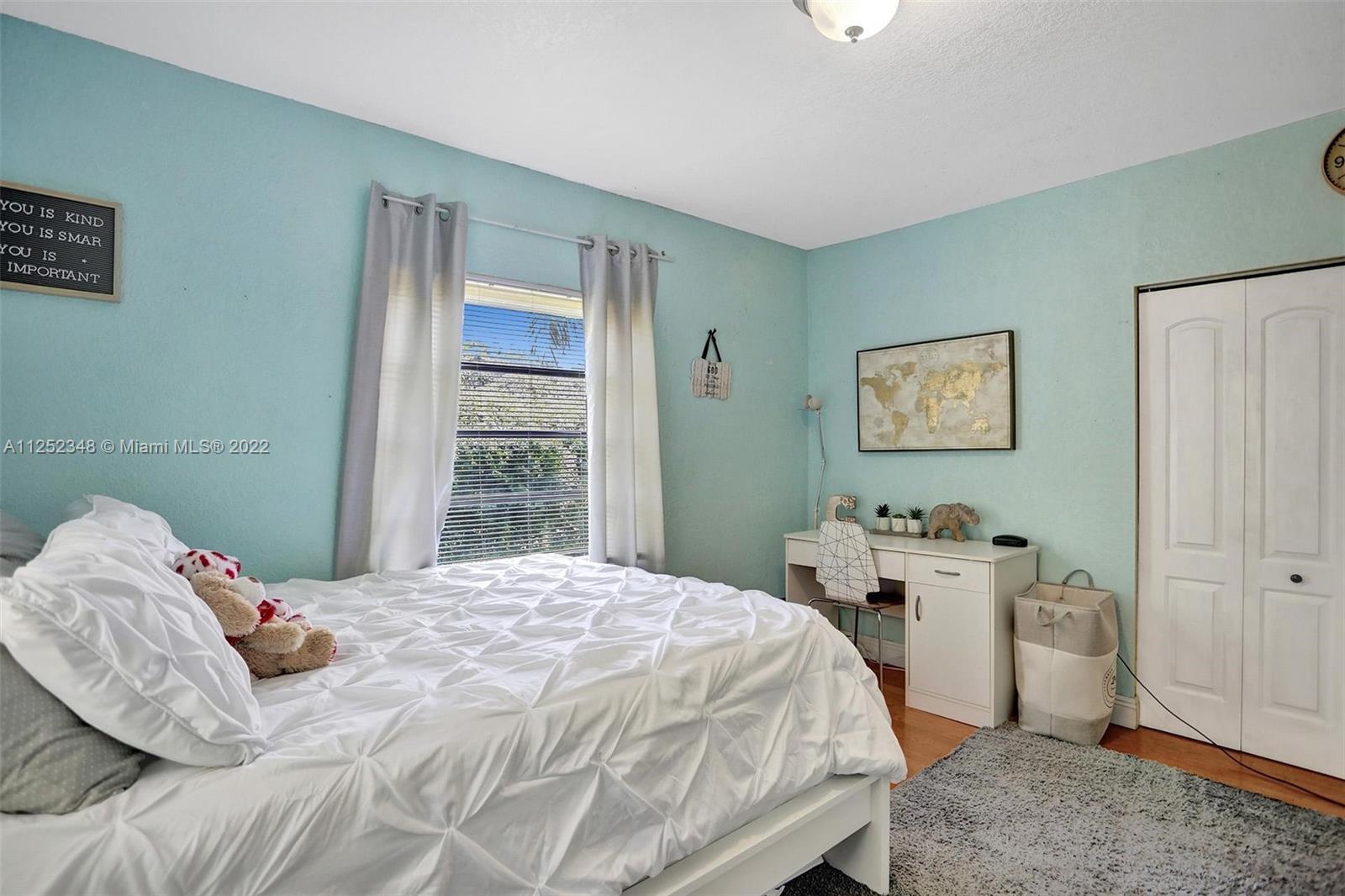 5930 Southwest 47th Street Miami, FL 33155 - Photo 20 of 43 a bedroom with a bed and a window