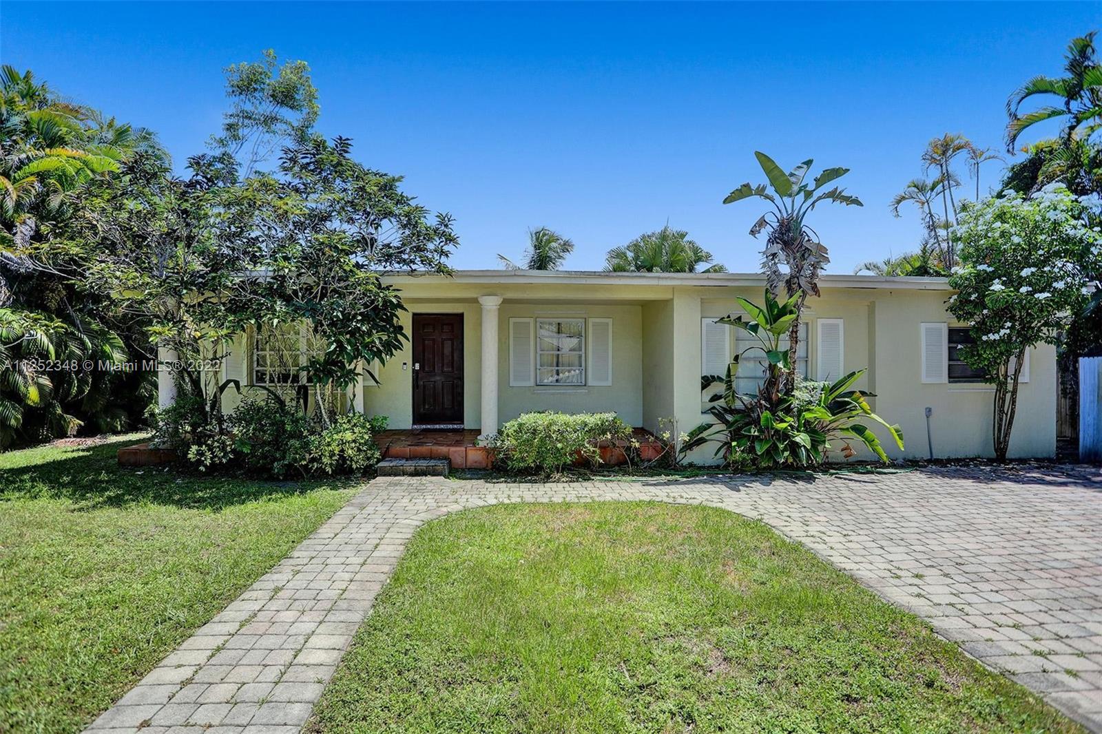 5930 Southwest 47th Street Miami, FL 33155 - Photo 2 of 43 a front view of a house with garden