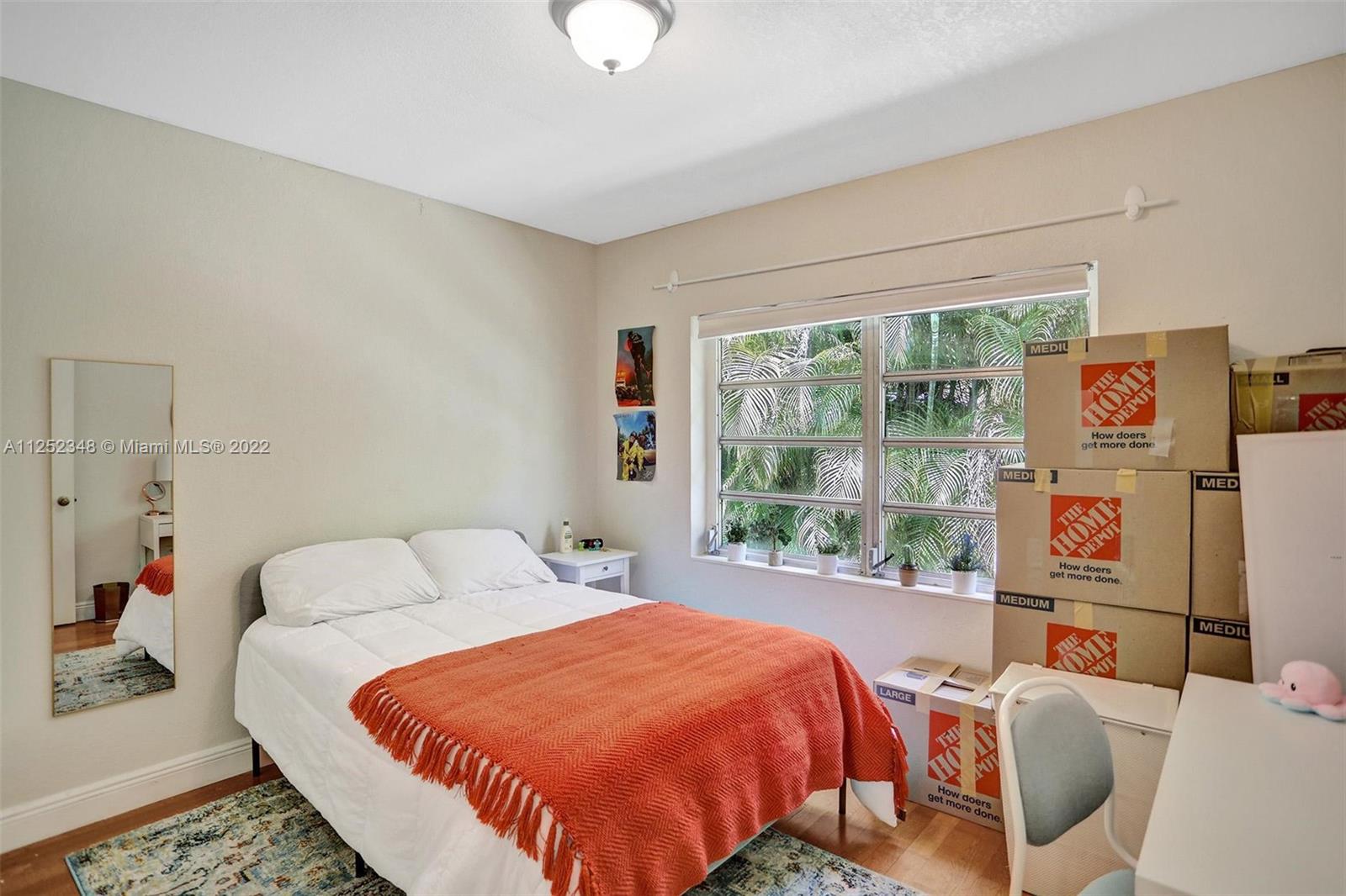 5930 Southwest 47th Street Miami, FL 33155 - Photo 21 of 43 a bedroom with bed and a large window