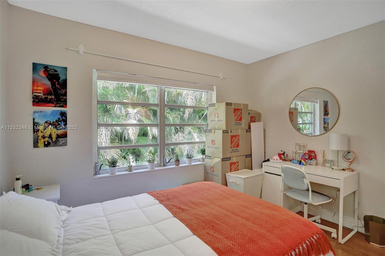 5930 Southwest 47th Street Miami, FL 33155 - Photo 22 of 43 a bed room with a bed mirror and a window