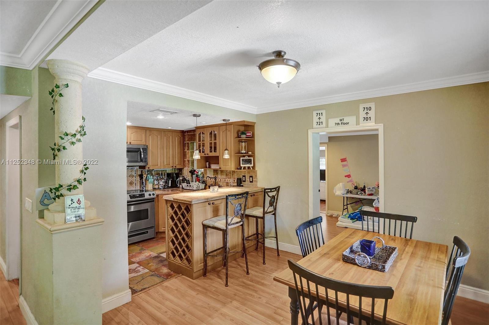 5930 Southwest 47th Street Miami, FL 33155 - Photo 28 of 43 a view of a dining room with furniture