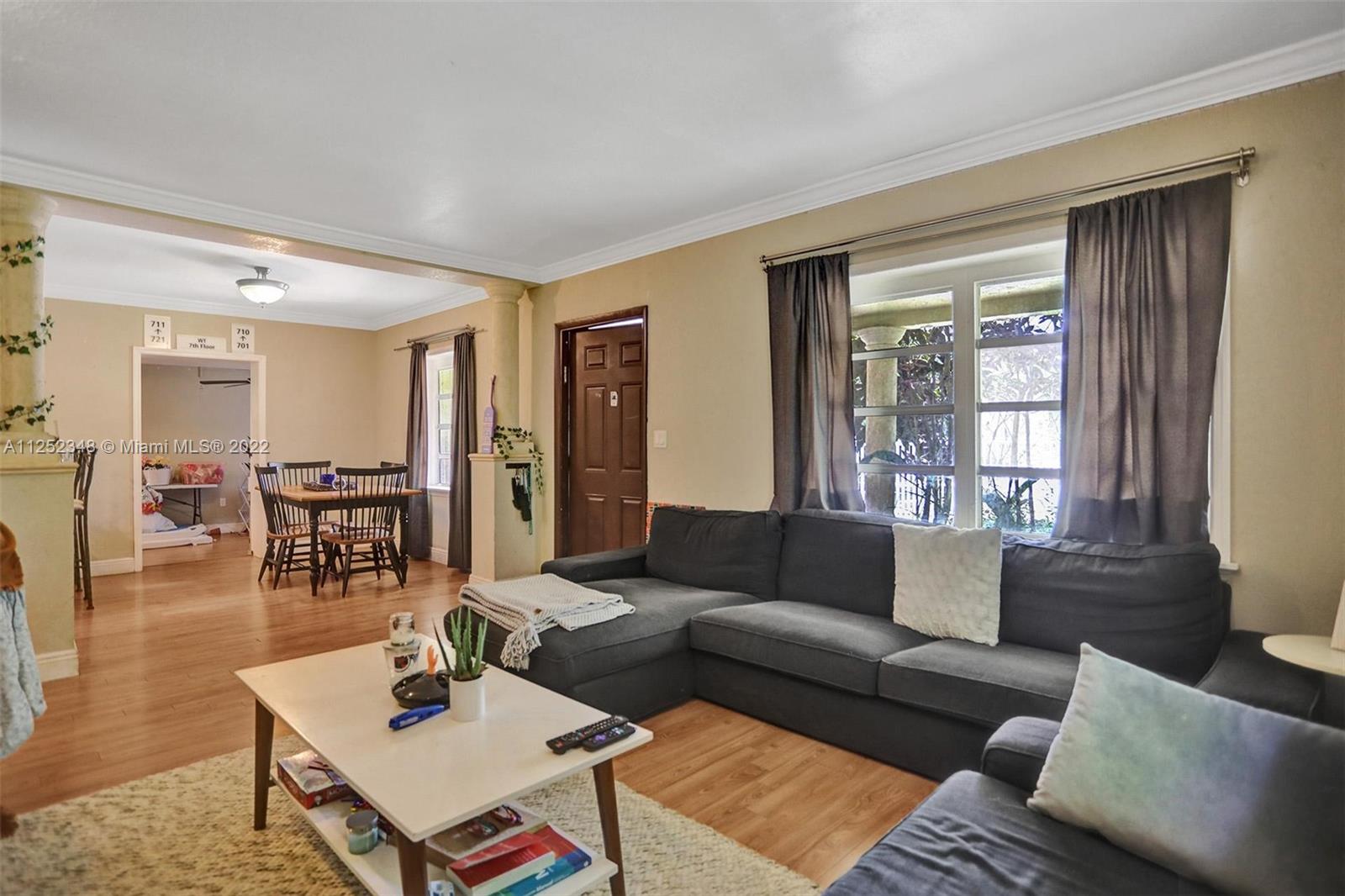 5930 Southwest 47th Street Miami, FL 33155 - Photo 30 of 43 a living room with furniture and wooden floor