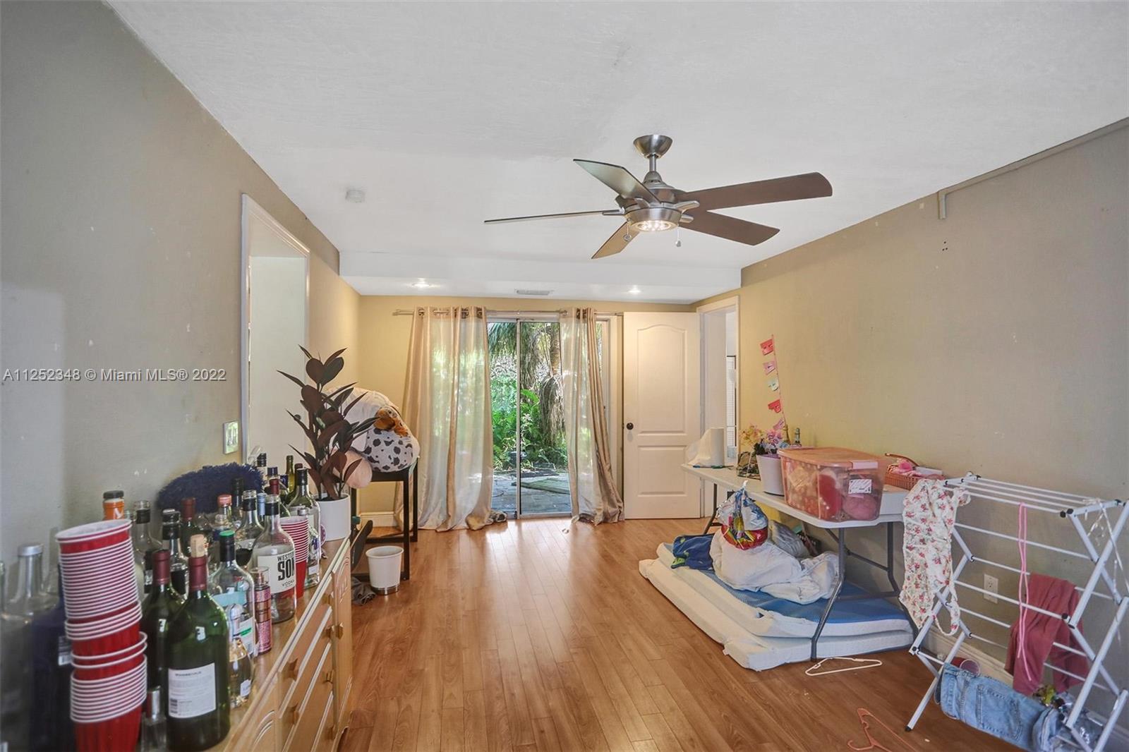 5930 Southwest 47th Street Miami, FL 33155 - Photo 36 of 43 a living room with furniture and wooden floor