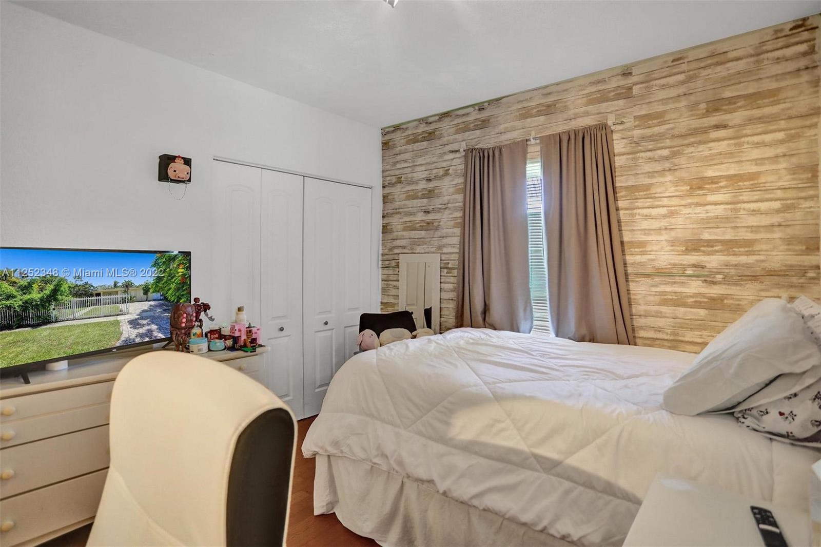 5930 Southwest 47th Street Miami, FL 33155 - Photo 40 of 43 a bedroom with a bed and a fish tank