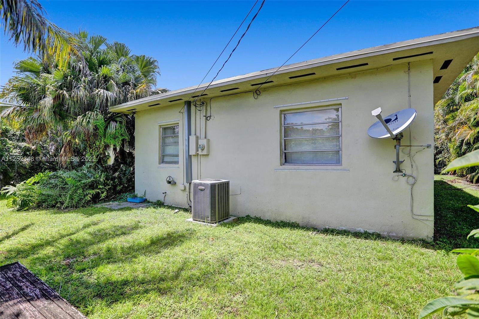 5930 Southwest 47th Street Miami, FL 33155 - Photo 10 of 43 a backyard of a house with plants and outdoor seating
