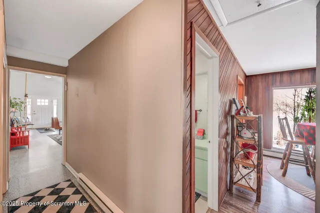 a living room with furniture and book shelf