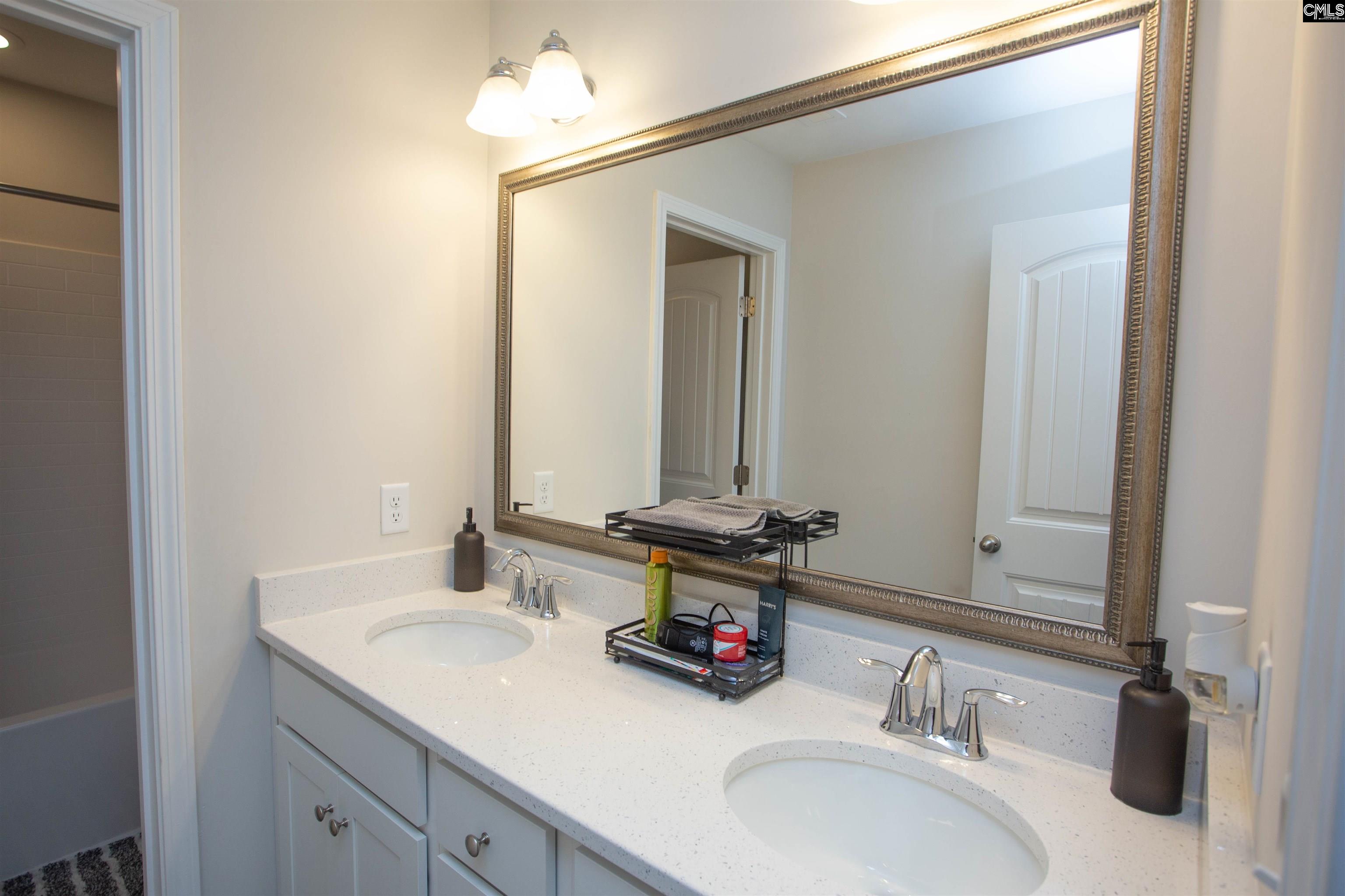 272 Shadowbrook Way Camden, SC 29020 - Photo 27 of 43 a bathroom with a double vanity sink and a mirror