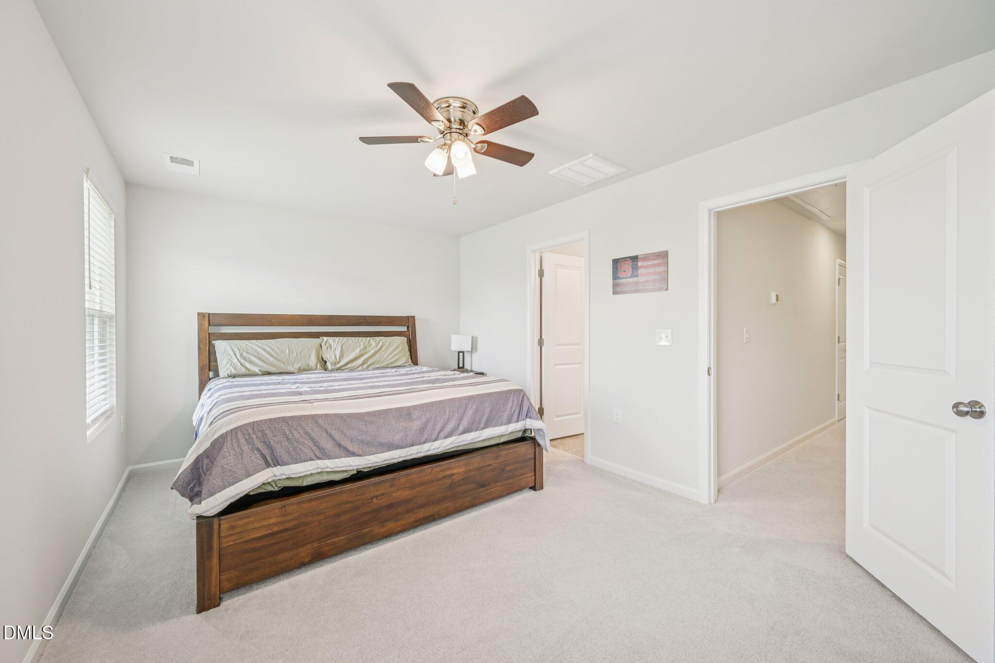 5348 Arkose Drive Raleigh, NC 27610 - Photo 14 of 21 a bedroom with a bed and window