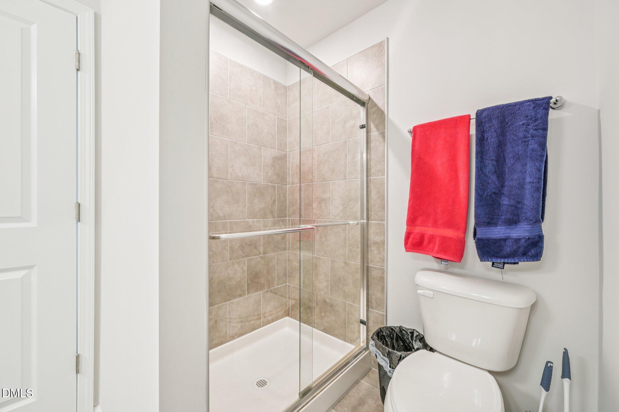 5348 Arkose Drive Raleigh, NC 27610 - Photo 16 of 21 a bathroom with a toilet and a shower