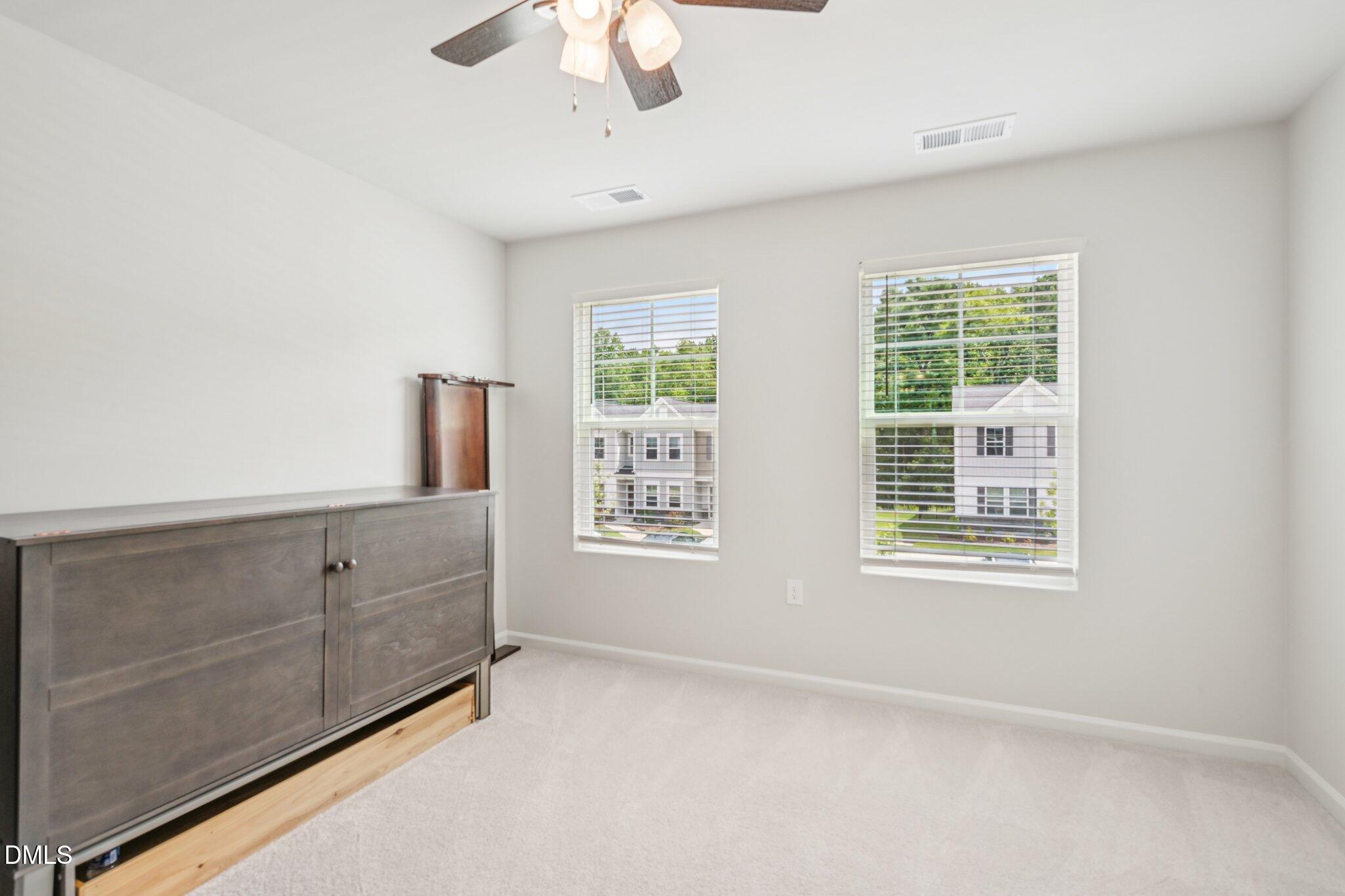 5348 Arkose Drive Raleigh, NC 27610 - Photo 17 of 21 a view of an empty room with a window
