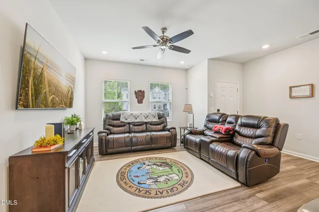 a living room with furniture a rug and a couch