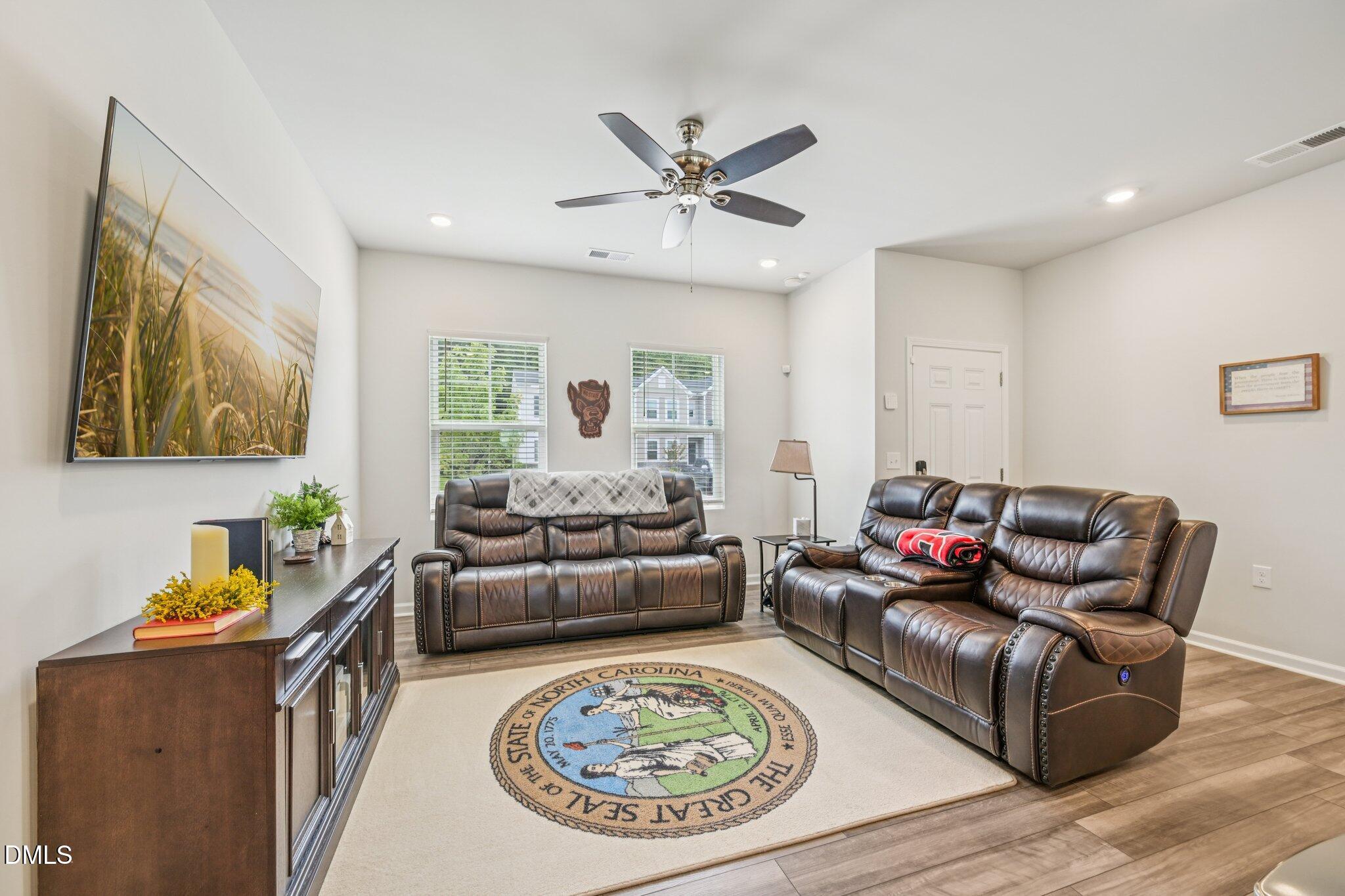 5348 Arkose Drive Raleigh, NC 27610 - Photo 4 of 21 a living room with furniture a rug and a couch