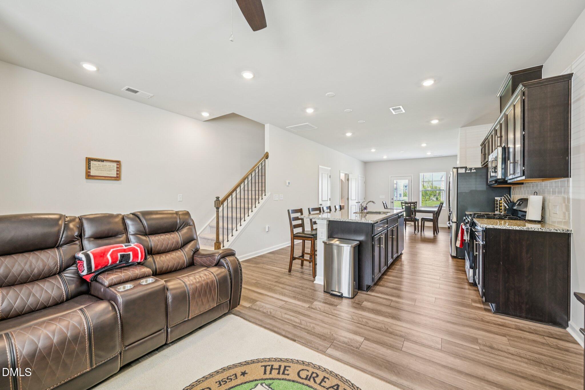 5348 Arkose Drive Raleigh, NC 27610 - Photo 5 of 21 a living room with furniture and a wooden floor
