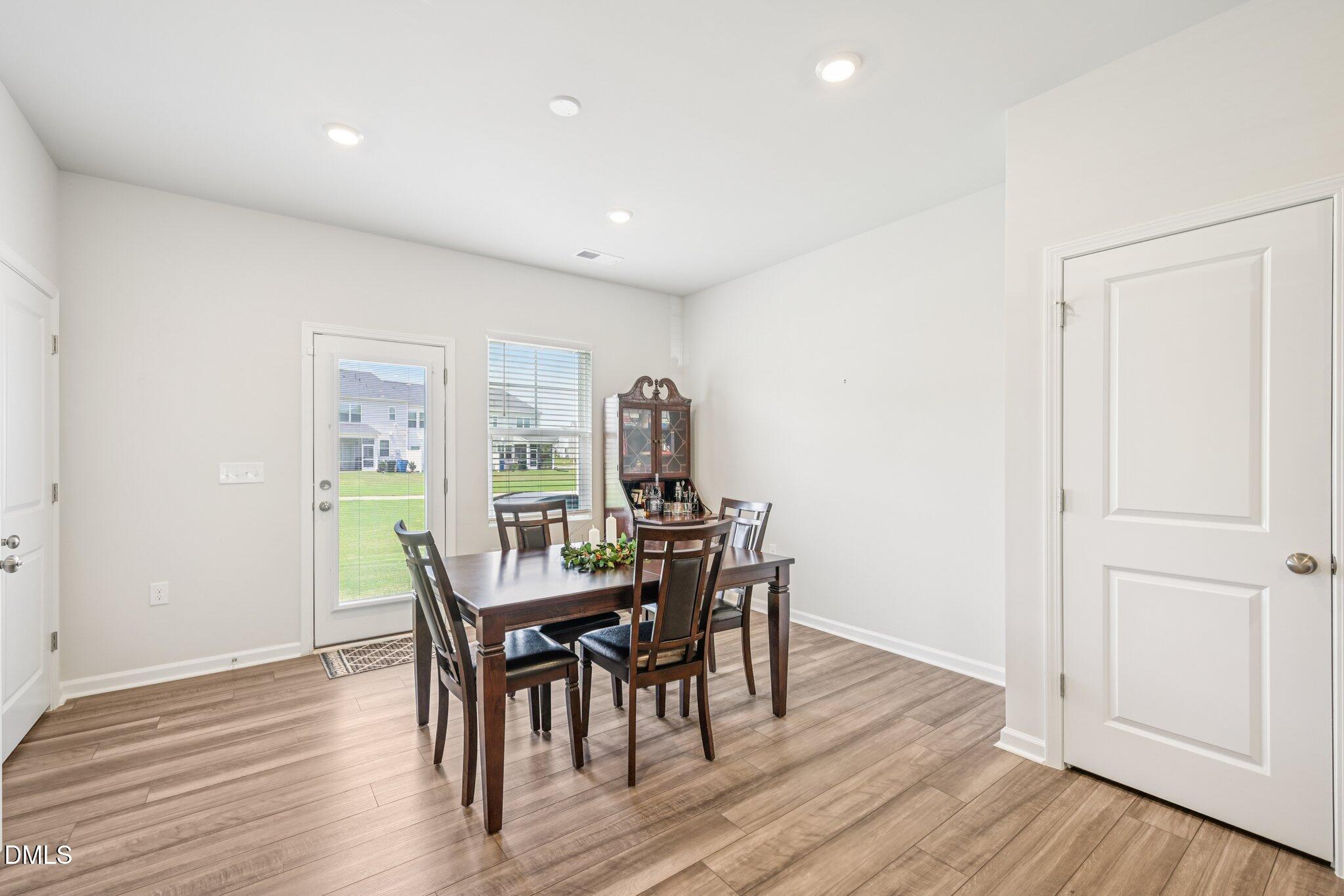 5348 Arkose Drive Raleigh, NC 27610 - Photo 6 of 21 a view of a dining room with furniture and wooden floor