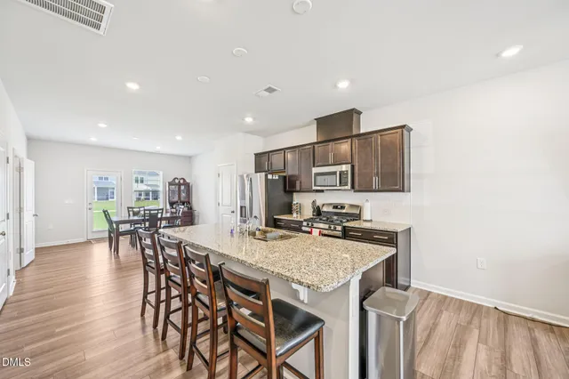 a kitchen with a table and chairs in it