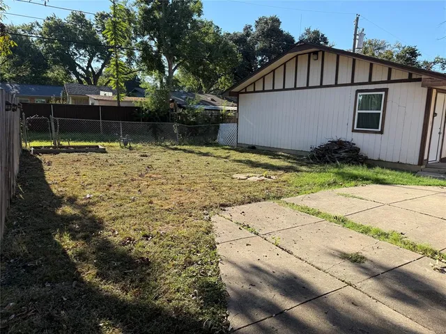 a house view with a backyard space