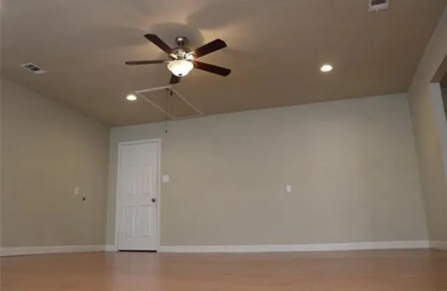 a view of a room with a fan