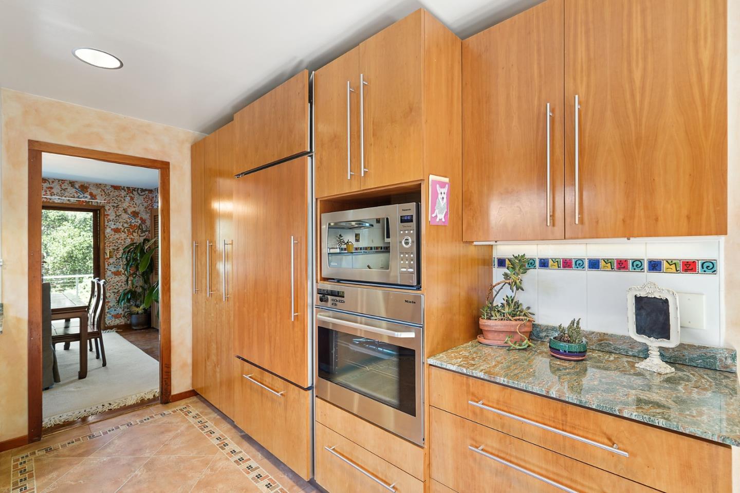 732 Knoll Drive San Carlos, CA 94070 - Photo 13 of 55 a kitchen with stainless steel appliances granite countertop a refrigerator and a sink