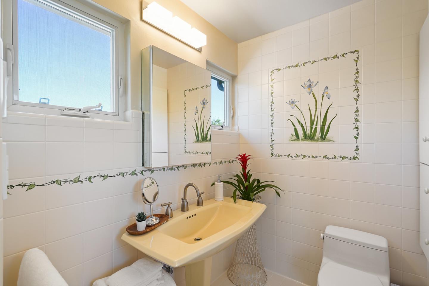 732 Knoll Drive San Carlos, CA 94070 - Photo 26 of 55 a bathroom with a sink a toilet and a mirror