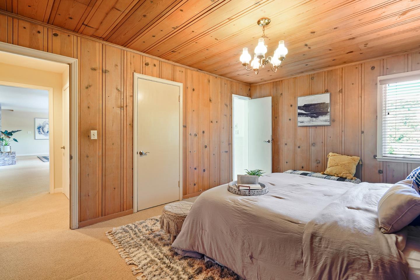 732 Knoll Drive San Carlos, CA 94070 - Photo 53 of 55 a bedroom with a bed and a chandelier