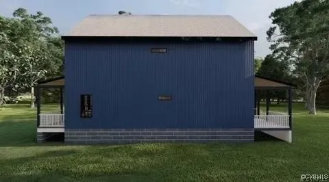 an aerial view of a house with garden space and a lake view