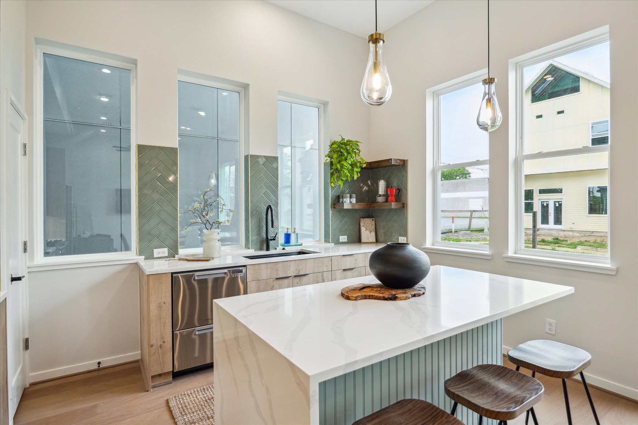 3908 Zina Way Houston, TX 77018 - Photo 14 of 33 a kitchen with a table and chairs in it
