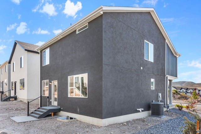 788 West 2840 South, Unit 2 Logan, UT 84321 - Photo 3 of 21 Contemporary townhome exterior featuring dark gray stucco siding and contrasting white trim