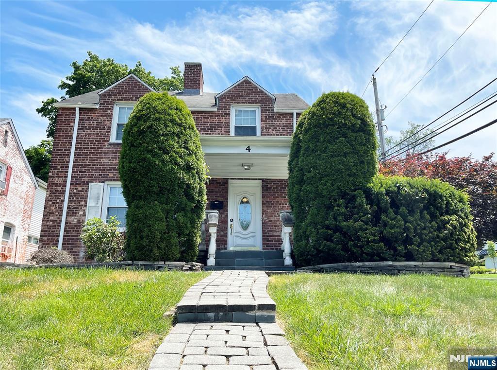 4 Oak Street Cresskill, NJ 07626 - Photo 1 of 12 a front view of a house with garden