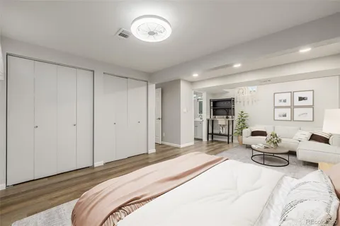 a bedroom with a bed and a chair