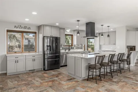 a kitchen with refrigerator cabinets and furniture