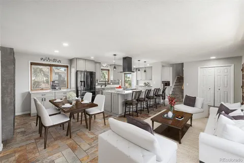 a living room with furniture and a table