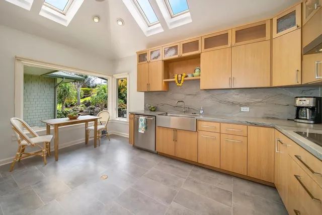 a kitchen with sink cabinets and outdoor living space