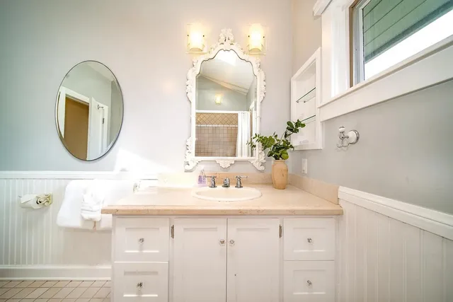 a bathroom with a sink and a mirror
