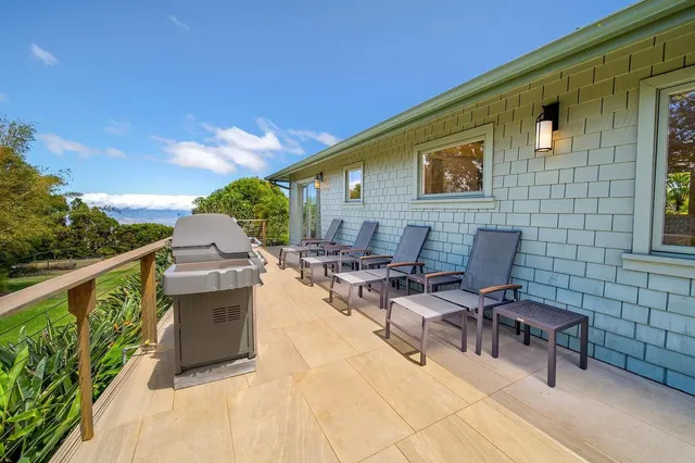 a backyard of a house with seating space