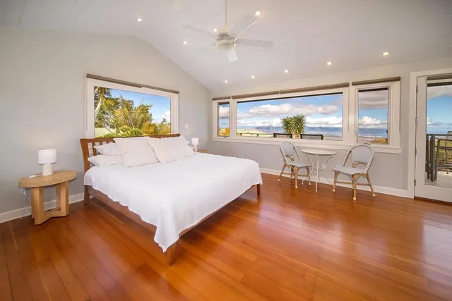 a bedroom with a bed and a table