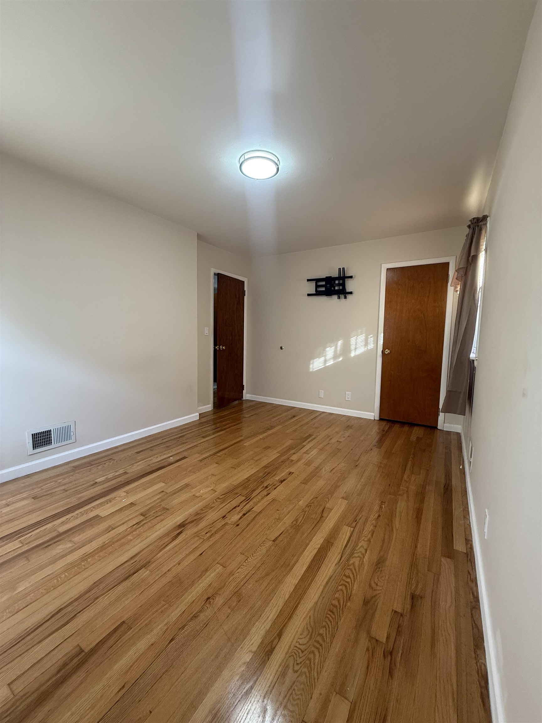 63 Prospect Avenue, Unit 2 Bayonne, NJ 07002 - Photo 14 of 14 a view of empty room with wooden floor