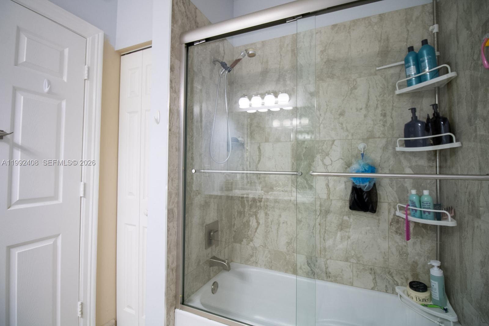 2607 Southwest 99th Way Miramar, FL 33025 - Photo 26 of 50 a bathroom with a shower