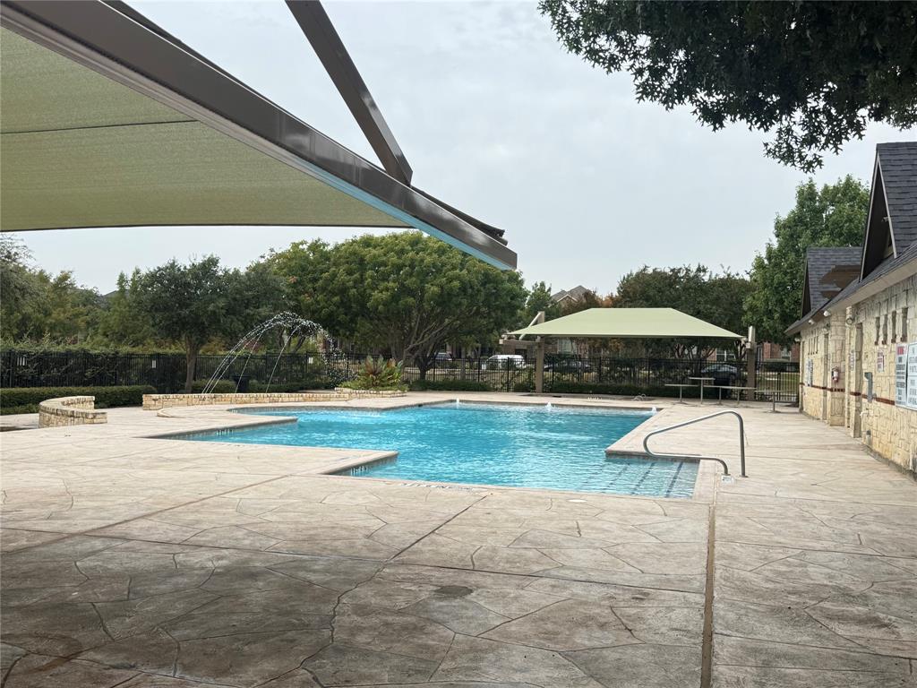 5412 Bentrose Drive McKinney, TX 75070 - Photo 19 of 24 a view of pool with lawn chairs under an umbrella