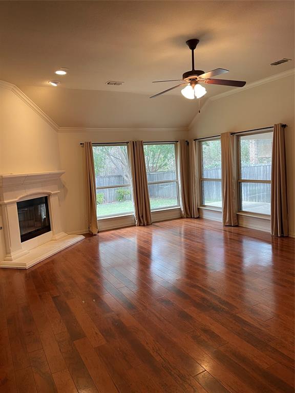 5412 Bentrose Drive McKinney, TX 75070 - Photo 7 of 24 wooden floor fireplace and windows in an empty room