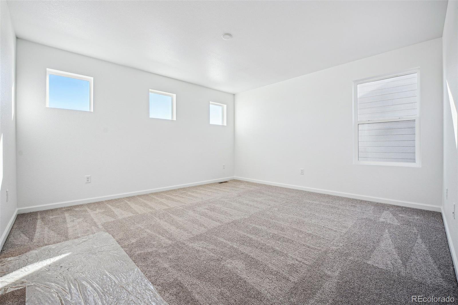2068 Chambers Road Brighton, CO 80601 - Photo 11 of 27 a view of an empty room with a window