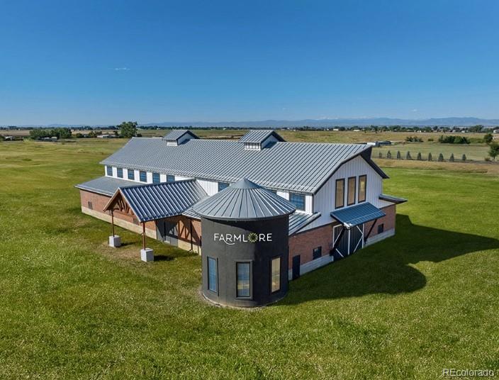 2068 Chambers Road Brighton, CO 80601 - Photo 27 of 27 an aerial view of a house with big yard and large trees